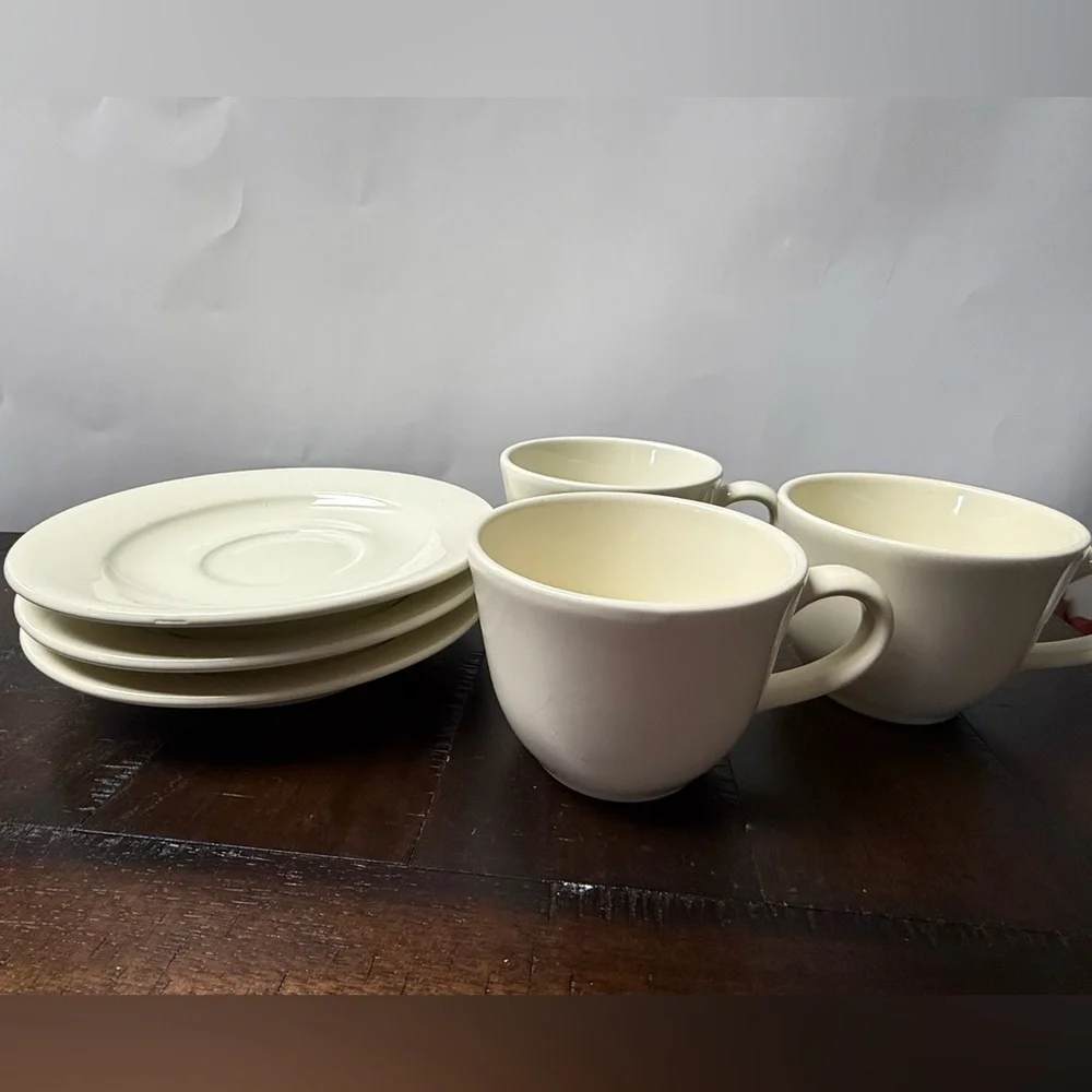 Williams Sonoma Belvedere Cream colored earthware flat cups and saucers